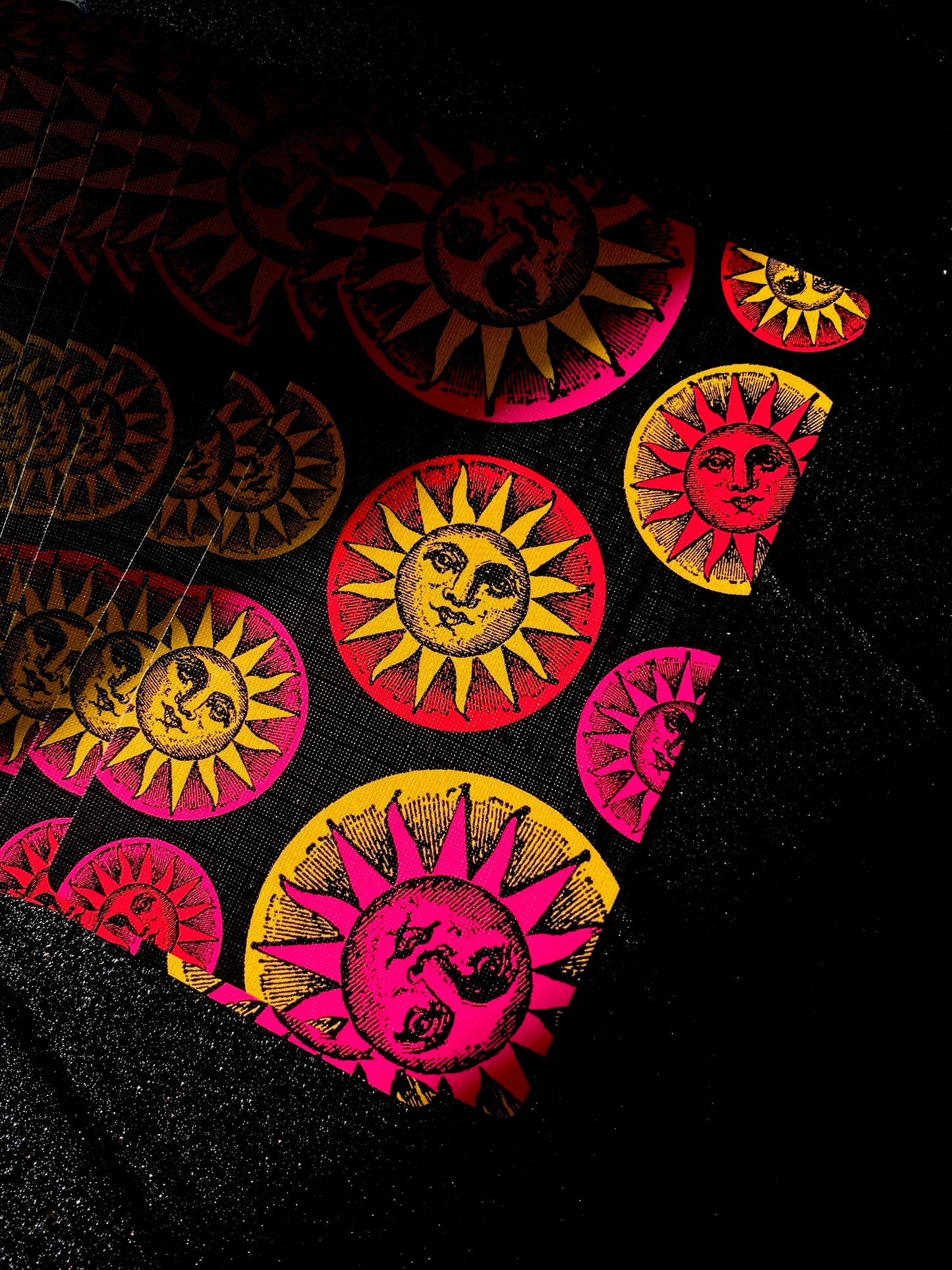 Deck featuring Colorful sun and moon designs on a black background