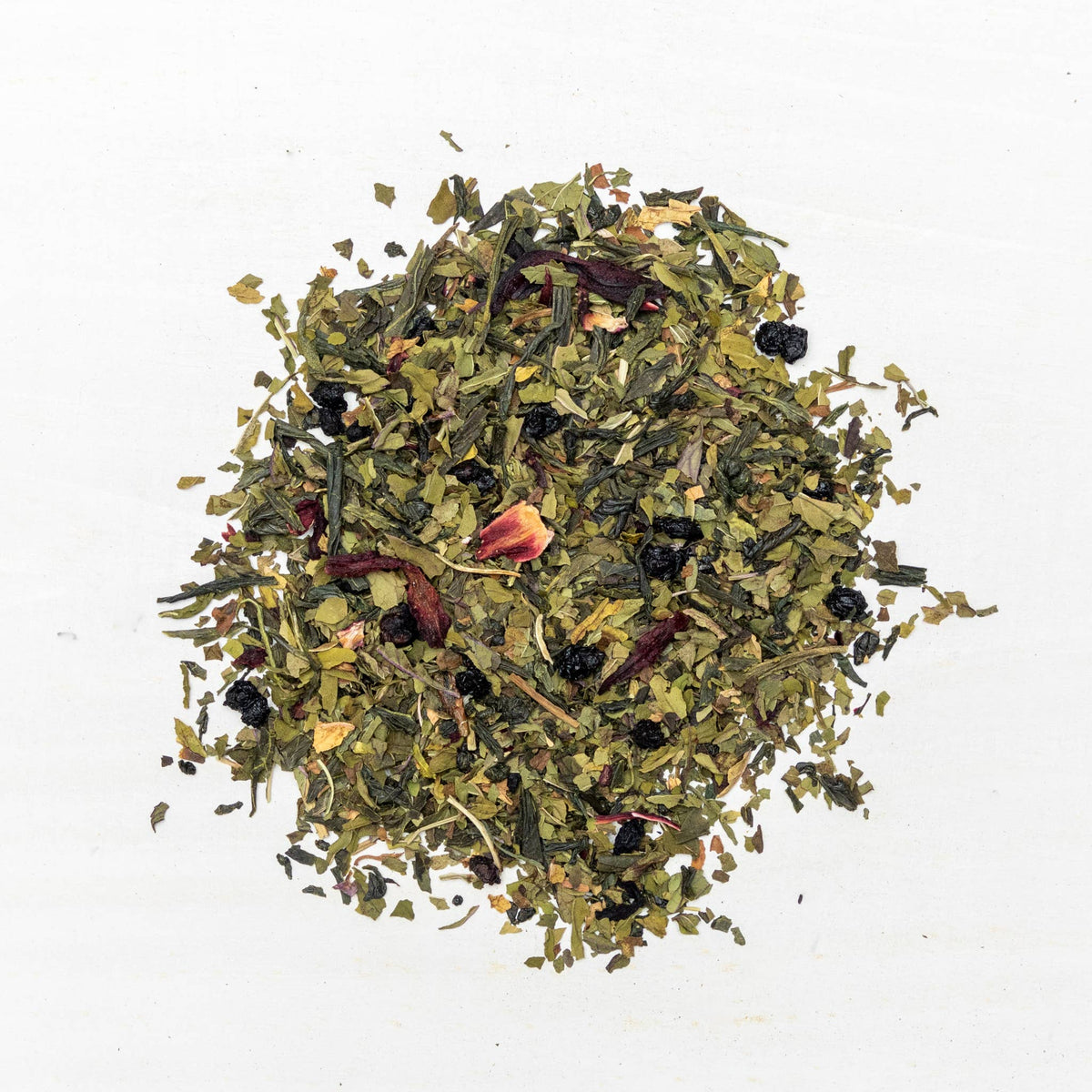 Mixture of dried herbs and leaves on a white background