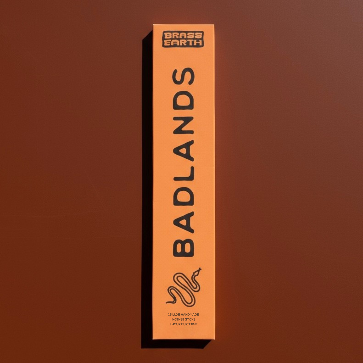 Box of 'Badlands' incense by Brass Earth on a brown background