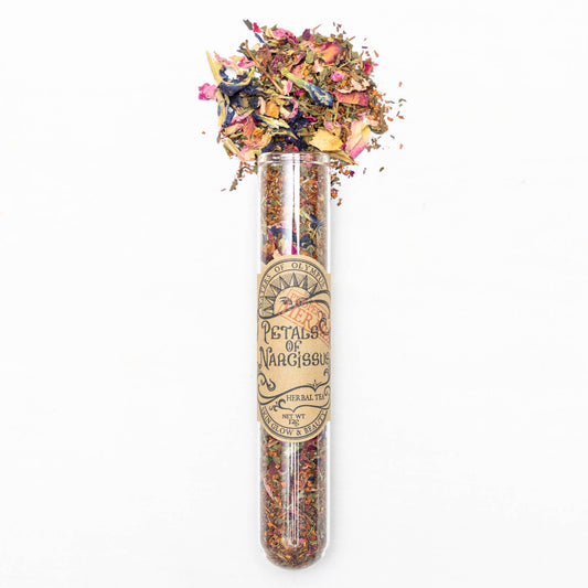 Herbal tea packaging with dried flowers on a white background