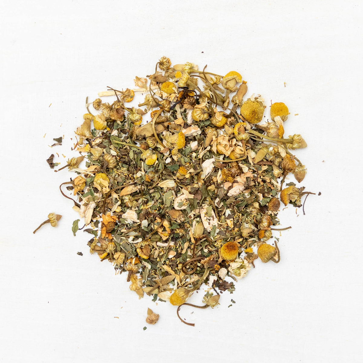 Heap of dried herbs and flowers on a white background
