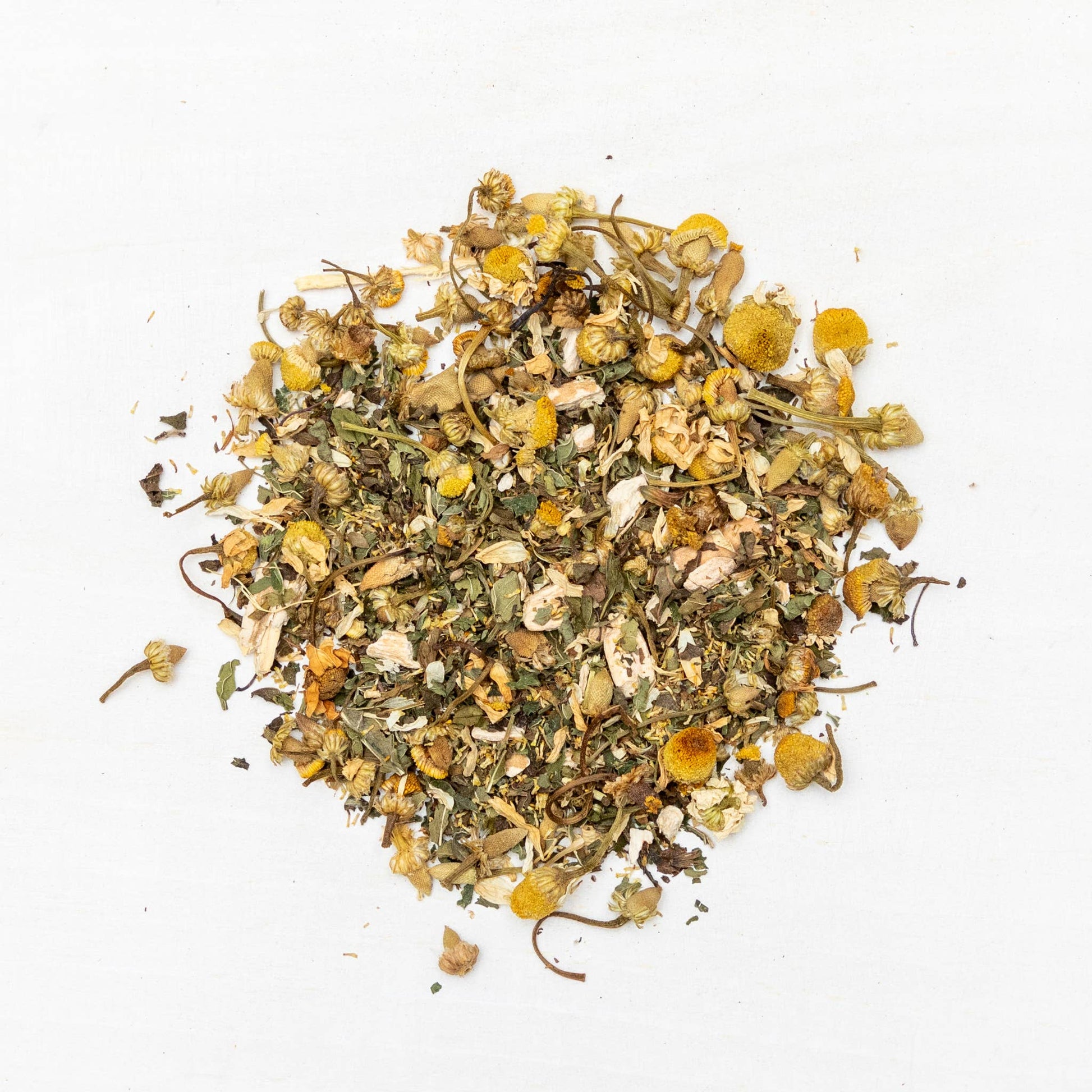 Heap of dried herbs and flowers on a white background