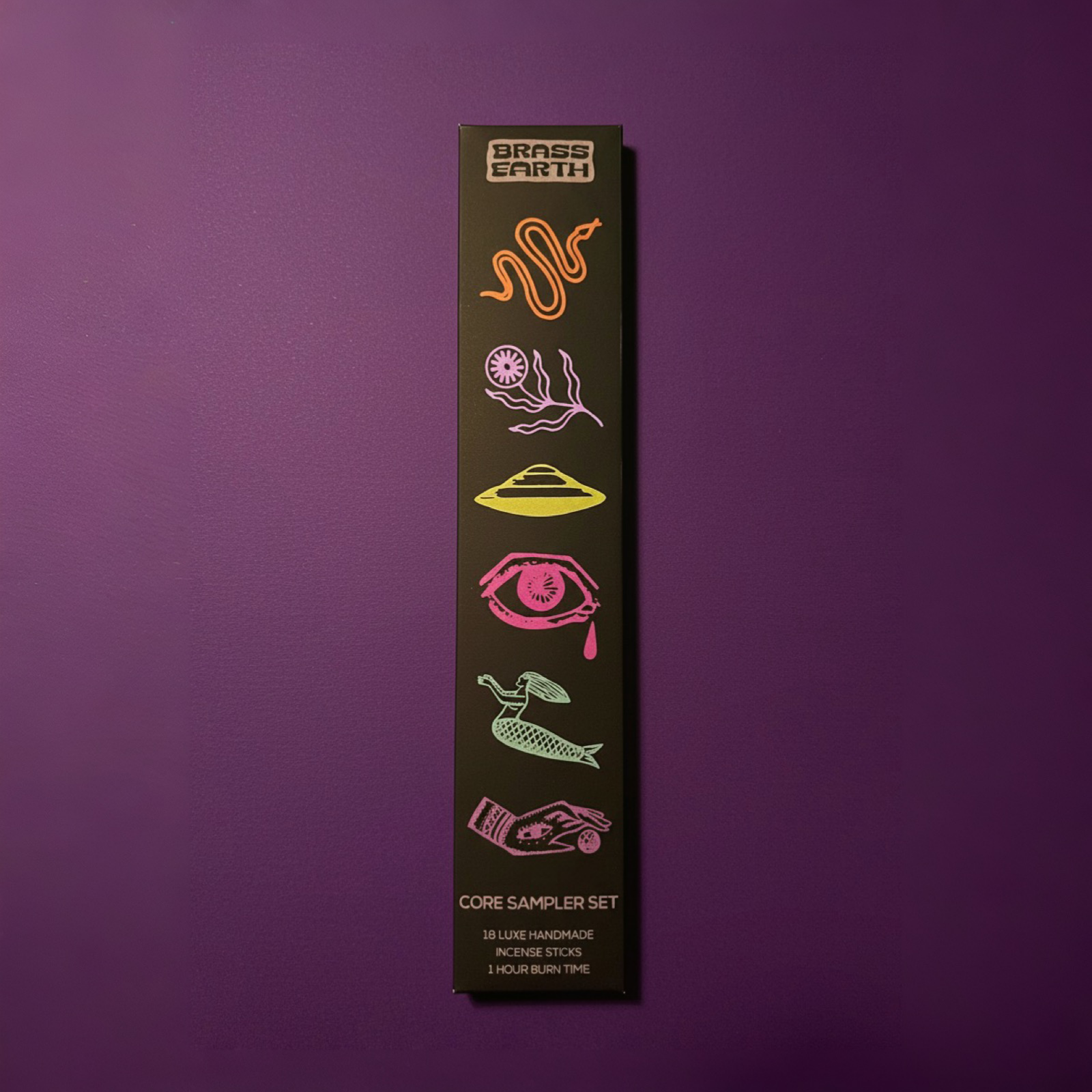 Black box with colorful symbols on a purple background