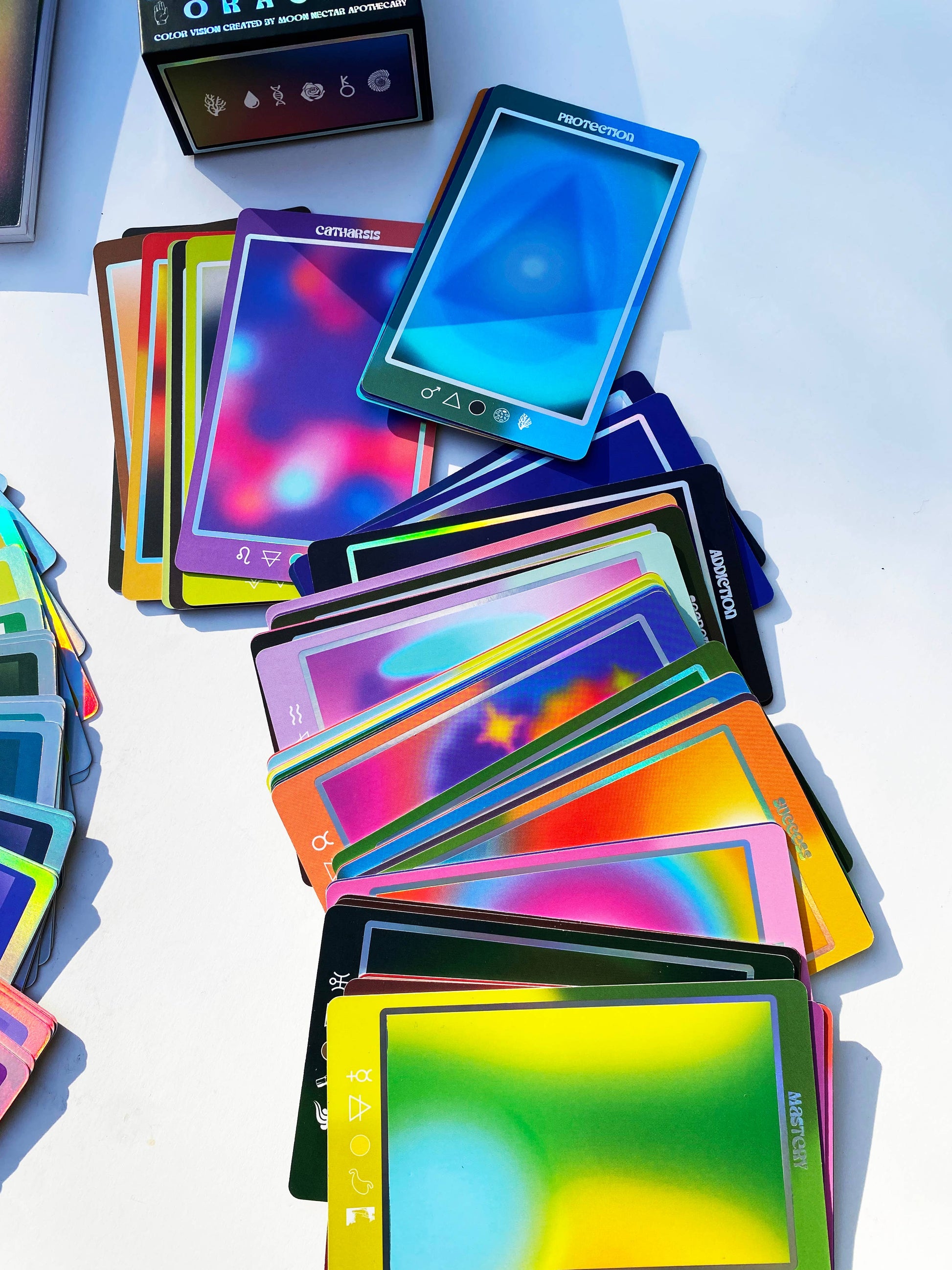 Color Vision Oracle Deck cards spread on a white surface