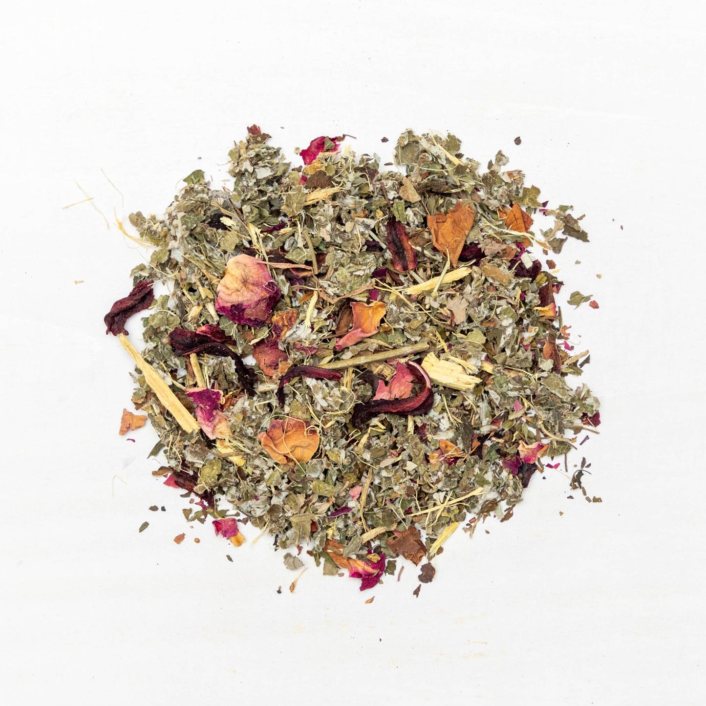 Heap of dried herbs and flowers on a white background