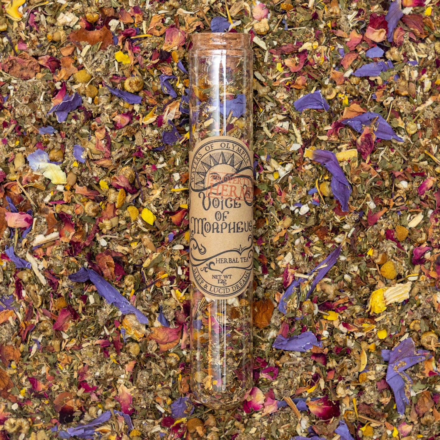 Herbal tea packaging with colorful dried herbs on a textured background