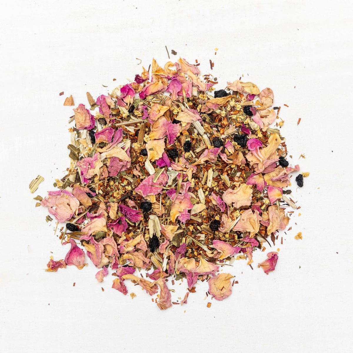 Colorful mix of dried flowers and herbs on a white background