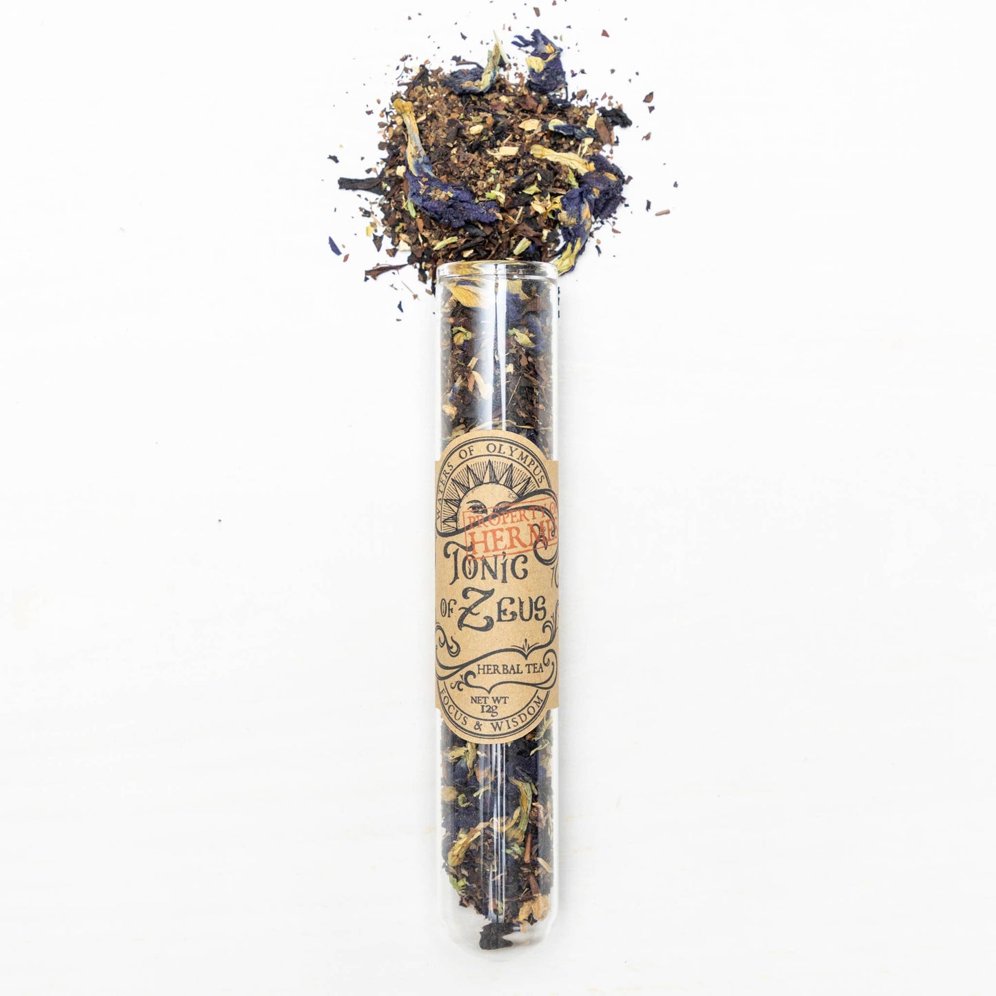 Tea leaves and flowers in a glass tube with a label on a white background