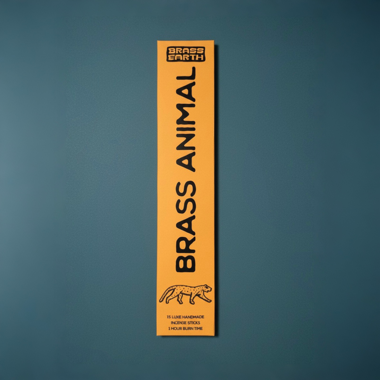 Brass Earth Brass Animal incense stick packaging on a blue background